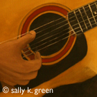 woman playing guitar