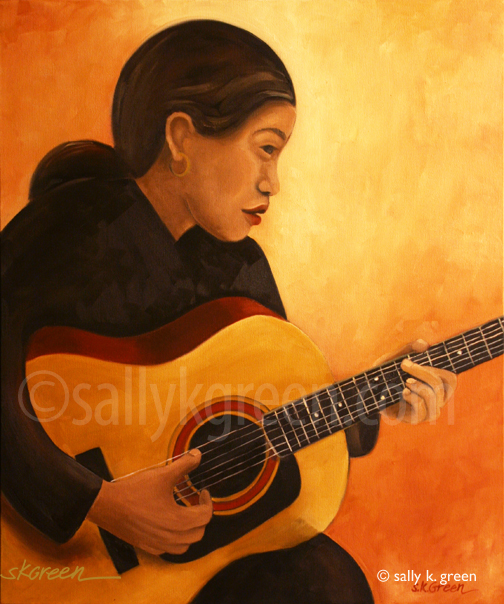 woman playing guitar